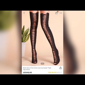 Black crisscross lace up suede thigh high boots.